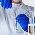 Close up of hands of a scientist working with laboratory samples