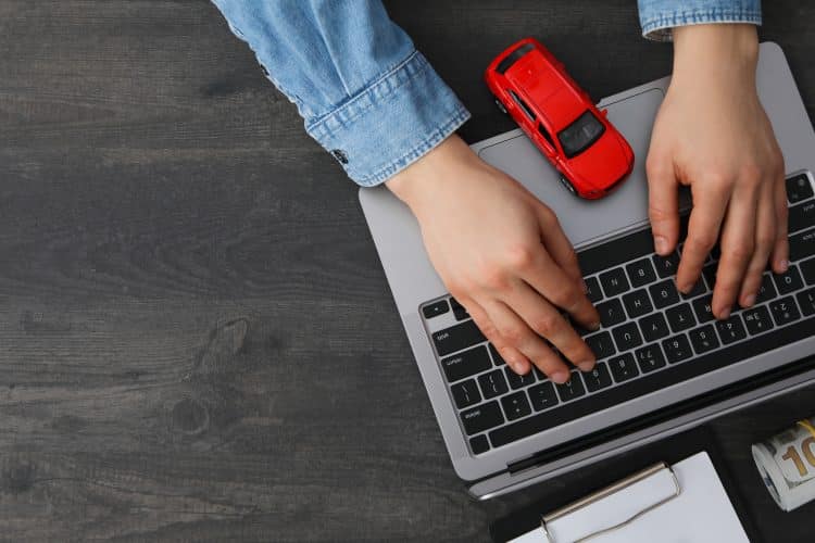 Concept of car purchase and insurance with toy car