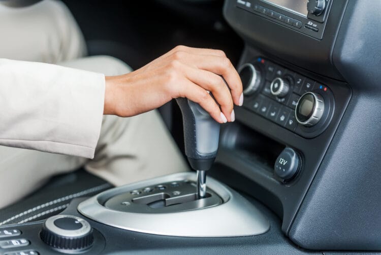 Woman in car. Close-up of woman in formalwear driving car